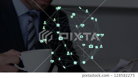 Image of network of connections over hands of caucasian businessman with coffee and newspaper 128582273