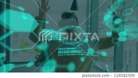 Image of scientific data over caucasian man wearing vr headset in office 128582300