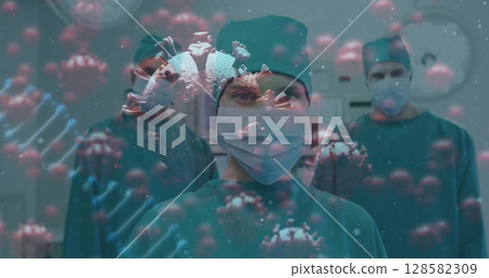 Showing female surgeon leading team in hospital operating room, with 3D virus and DNA overlays Showing female surgeon leading team in hospital operating room, with 3D virus and DNA overlays 128582309