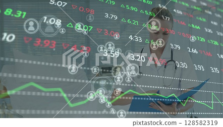 Image of financial data over caucasian female doctor making notes Image of financial data over caucasian female doctor making notes 128582319