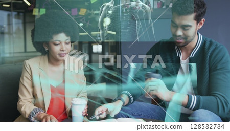 Screens with data processing against diverse male and female office colleagues discussing at office 128582784