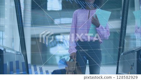 Image of financial data processing over african american businesswoman 128582929