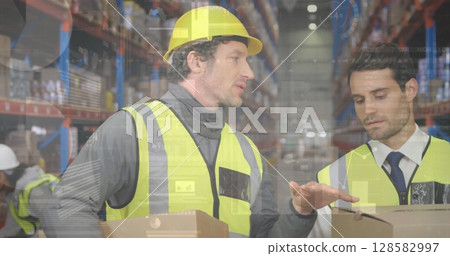 Image of financial data processing over two caucasian warehouse worker Image of financial data processing over two caucasian warehouse worker 128582997