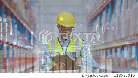 Image of financial data processing over biracial warehouse worker Image of financial data processing over biracial warehouse worker 128583010