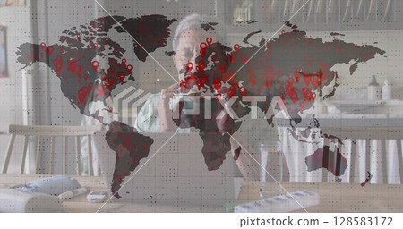 Image of data processing over senior biracial man using laptop 128583172