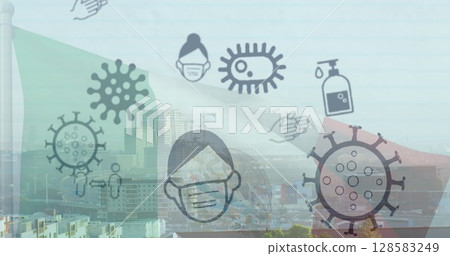 Displaying virus symbols, masked face and sanitizer floating over urban skyline, with flag stripes 128583249