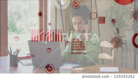 Image of covid 19 cells and statistics over biracial businesswoman using phone and laptop Image of covid 19 cells and statistics over biracial businesswoman using phone and laptop 128583262