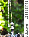 Drinking water from the tap in the park 128583542