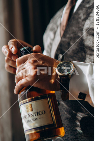 View on friends having alcoholic drinks in the bar, close-up View on friends having alcoholic drinks in the bar, close-up 128584066