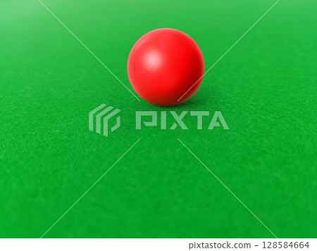 Red snooker balls on a green felt snooker table. 128584664