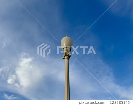 a street lamp on a blue sky background. High quality photo 128585145