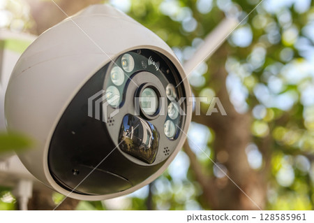 Security IP CCTV camera using solar energy install on the tree for home security system Security IP CCTV camera using solar energy install on the tree for home security system 128585961