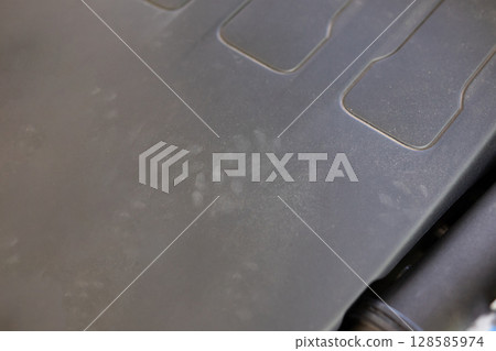 Rat footprint in the car engine 128585974
