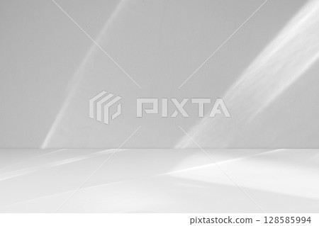 Abstract white studio room with light and shadow from window background for product display presentation Abstract white studio room with light and shadow from window background for product display presentation 128585994