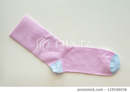 Purple cotton sport socks on white background 128586036