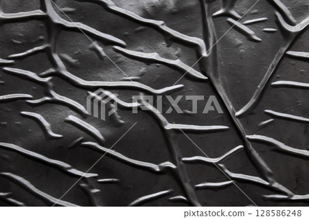 black crumpled and creased plastic poster texture background black crumpled and creased plastic poster texture background 128586248