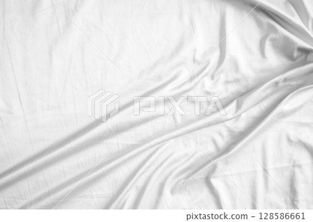 Abstract white wrinkled bedding sheet fabric texture background Abstract white wrinkled bedding sheet fabric texture background 128586661