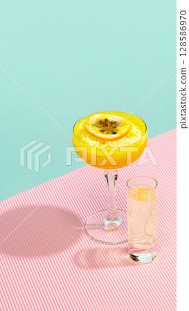 Cocktail Porn Star Martini with passionfruit garnish and shot of prosecco 128586970