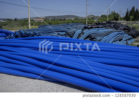 Blue PVC pipes, plastic pipes for water supply 128587030