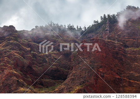 Dark coastal landscape with red cliffs of Madeira. Portugal 128588394