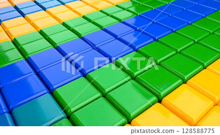 Abstract pattern made of colorful toy cubes forming diagonal stripes 128588775