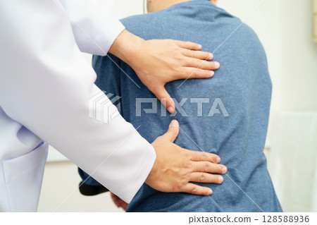 Physical therapy, Asian therapist doctor treat perform pain therapy in hospital. Physical therapy, Asian therapist doctor treat perform pain therapy in hospital. 128588936