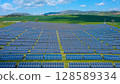 Rows of solar panels on a green meadow in Greece. 128589334