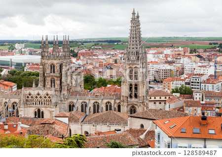 Historic Burgos Cathedral towering over the cityscape of Burgos, Spain on a cloudy day 128589487
