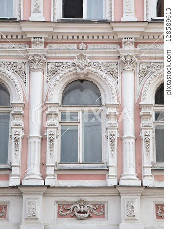 Architectural details of a historic building in a European city showcasing classical design elements Architectural details of a historic building in a European city showcasing classical design elements 128589613
