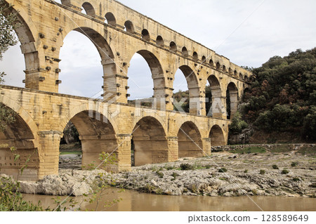 Exploring the grandeur of Pont du Gard aqueduct bridge in France 128589649