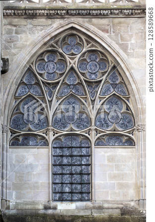 Gothic window in Carcassonne, France, with intricate designs Gothic window in Carcassonne, France, with intricate designs 128589668
