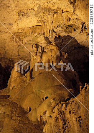 Stalagmite formation in the depths of Grottes de Betharram, France, revealing nature's artistry and beauty 128589718
