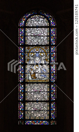 Stained glass window in Saint-Sernin basilica, Toulouse revealing intricate biblical scenes Stained glass window in Saint-Sernin basilica, Toulouse revealing intricate biblical scenes 128589741