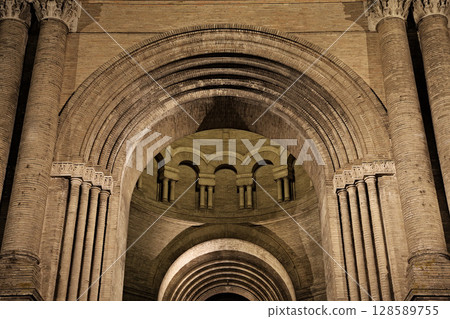 Architectural details of a historic structure in Toulouse, France, arches and columns at night 128589755