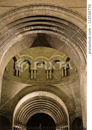 Architectural details of a historic structure in Toulouse, France, arches and columns at night 128589756