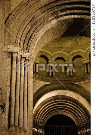 Architectural details of a historic structure in Toulouse, France, arches and columns at night 128589757