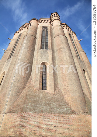 Sainte-Secile cathedral brick architecture in Albi, France under a clear blue sky 128589764