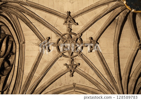 Vaulted ceiling of Sainte-Secile Cathedral in Albi, France, symmetric gothic architecture details Vaulted ceiling of Sainte-Secile Cathedral in Albi, France, symmetric gothic architecture details 128589783