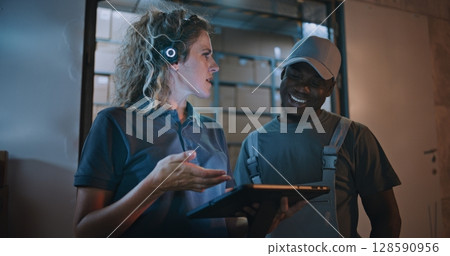 Worker and Female Manager Using Tablet Computer, Standing Outside of Logistics Retail Warehouse 128590956