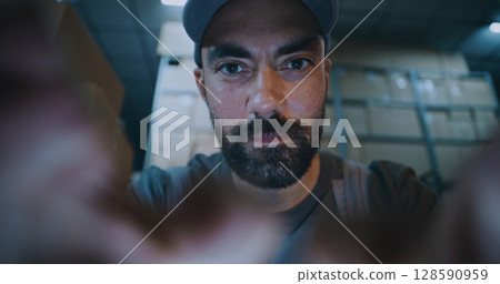 POV from Smartphone Screen: Male Worker Using Phone, Chatting in Social Networks 128590959