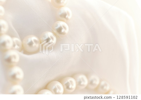 The whimsical placement of pearls on a white cloth depicts a serene, dreamy scenario. It's an invitation to pause and appreciate the natural amidst the rush for the new and artificial. 128591102
