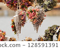 Handmade heart decorations with dried flowers 128591391