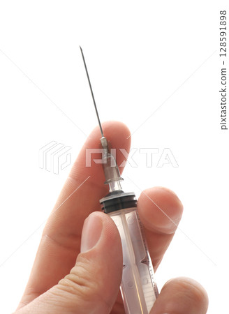 Syringe in hand 128591898