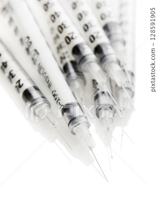 Insulinic syringes on a white background 128591905