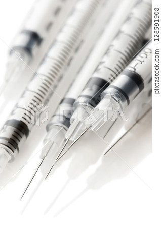 Insulinic syringes on a white background Insulinic syringes on a white background 128591908