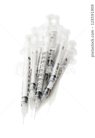 Insulinic syringes on a white background Insulinic syringes on a white background 128591909