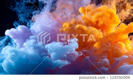 Vibrant colorful smoke plumes: blue, purple, orange swirls in motion. 128592009