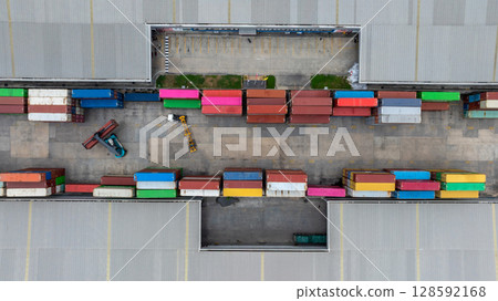 Aerial view semi truck cargo trailer at logistic park warehouse goods, Distribution warehouse shipping supply chain, Business transportation logistic freight shipping cargo by semi truck cargo 128592168