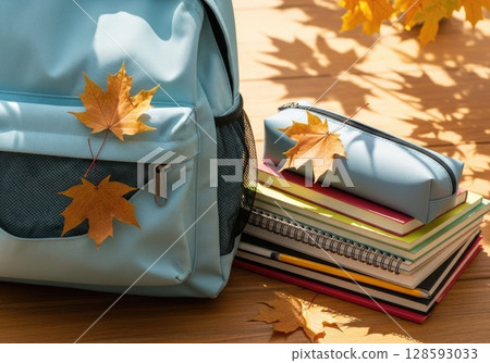 Fresh Start: New Backpack with School Supplies and Autumn Leaves Fresh Start: New Backpack with School Supplies and Autumn Leaves 128593033