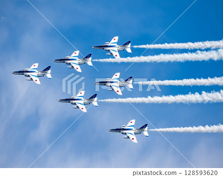 Blue Impulse flying in the blue sky Blue Impulse flying in the blue sky 128593620
